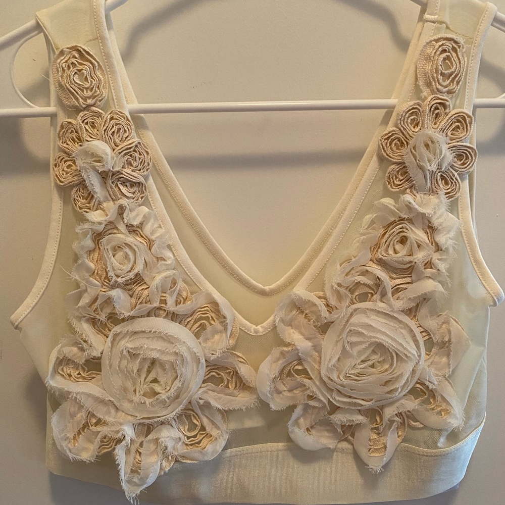 BEBE sheer statement crop top. Ivory.
